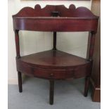 A George III and later mahogany quadrant washstand, raised on ring turned and block supports  37"