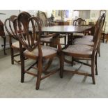 A Regency style crossbanded mahogany twin pedestal dining table, raised on splayed legs  29"h  60"