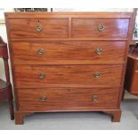 A late George III string inlaid mahogany dressing chest with two short/three long drawers, raised on