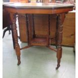 An Edwardian walnut occasional table, the octagonal top raised on ring turned and block supports,