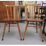 Two Ercol beech and elm framed chairs with curved bar backs and spindle supports, the solid seats