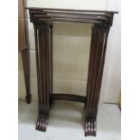An early 20thC quartetto of mahogany occasional tables, raised on turned pillar supports and splayed