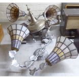 Early 20thC lighting, in stylised silvered fittings: to include two pairs of wall lamps with