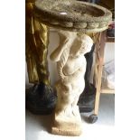 A composition stone birdbath, the column fashioned as a cherub  32"h