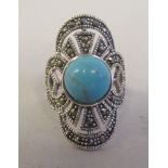 An Art Deco style silver coloured metal and marcasite dress ring, set with turquoise