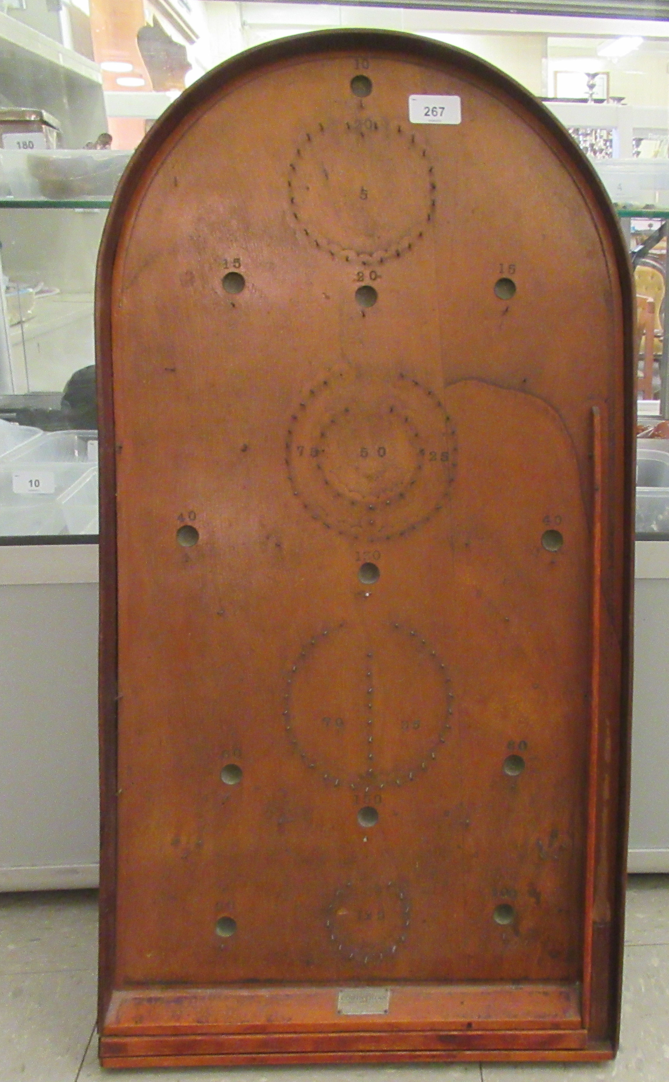 An early 20thC Corinthian bagatelle board with steel balls