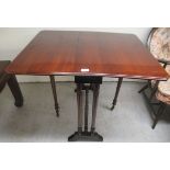 An Edwardian mahogany Sutherland table, raised on turned pillars and splayed bracket feet  28"h