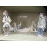 Three Lladro porcelain figures, clowns in various poses  largest 8"h