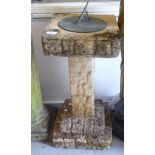 A modern composition stone garden sundial, on a pedestal base  24"h  12"w