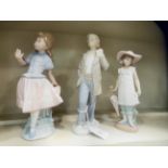 Three Nao porcelain figures: to include a young girl holding an umbrella  6"h