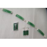 A suite of modern Oriental jade and silver coloured metal mounted jewellery, viz. a bracelet, a pair
