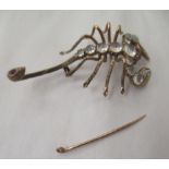 A gold coloured metal scorpion brooch, set with rubies and moonstones  boxed