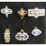 Six various silver gilt dress rings: to include an Art Deco style paste set example