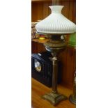 A late Victorian brass oil lamp with a reeded column, on a stepped square foot  23"h