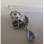 A silver coloured metal plique a jour necklace and pendant, set with blue topaz