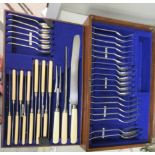 A 1920s canteen of stainless steel flatware and cutlery, on simulated ivory handles  comprising
