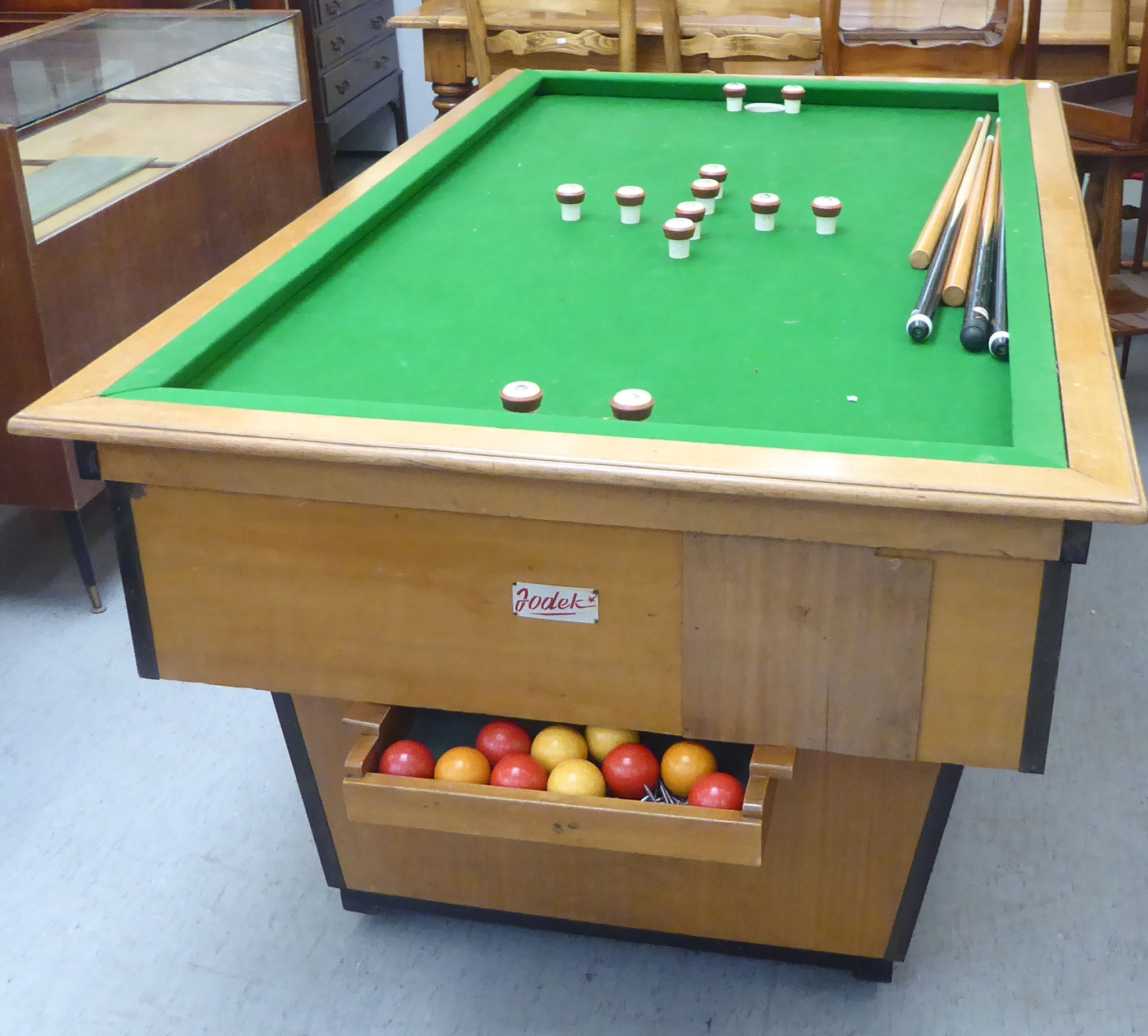 A modern Jodek mahogany finished and framed bumper pool/bar billiards table with a green baize lined