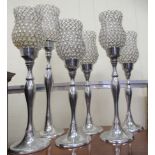 Six similar modern chromium finished pedestal candlestands, each with glass shades  tallest 26"h