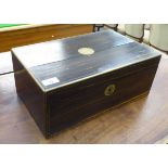 A 19thC brass inlaid Macassar ebony writing box, the angled hinged lid enclosing a fitted