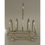 A silver wire four division toastrack, on ball feet  Elkington & Co  Birmingham 1912