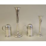 A pair of late Victorian silver pepper pots of cylindrical form with looped wire handles and