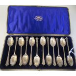 A set of twelve Edwardian silver teaspoons with decoratively cast stems  Goldsmiths &