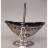 A George III silver sugar basket of oval form with bead bordered, uniformly pierced and floral