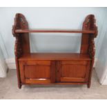 Late 19thC hanging mahogany shelf with a two door cupboard and pierced planked ends  25"h  25"w