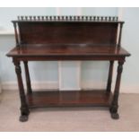 A late Regency rosewood buffet with bead and reel and stiff leaf carved ornament, the galleried half