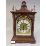 An early 20thC Georgian style, pillow top, walnut cased bracket clock with applied, decorative