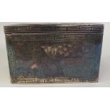 An Asian engraved white metal box with straight sides and a cover, decorated with dragons, forest