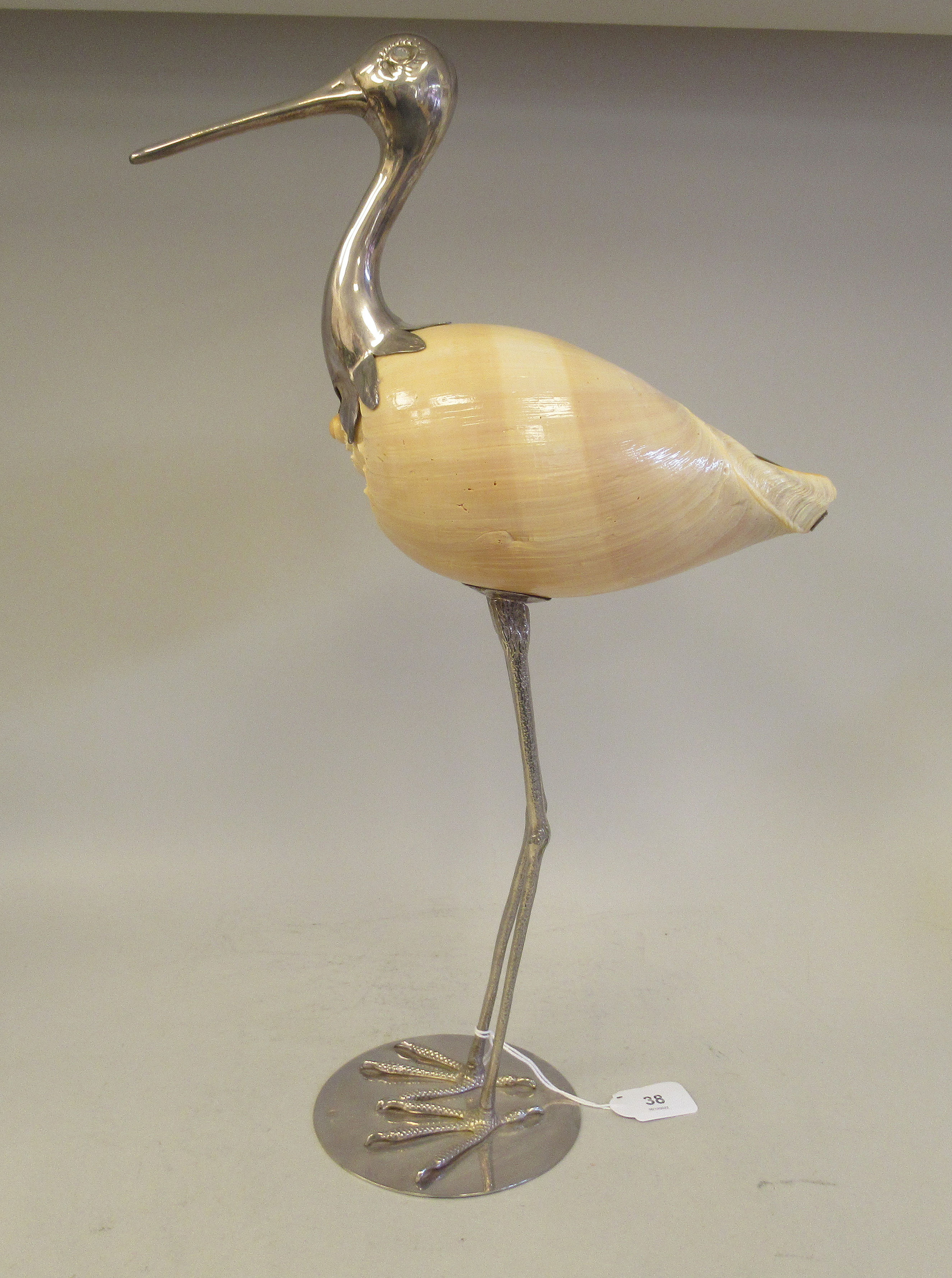 A 1970s Gabriella Binazzi white metal and shell sculpture, a wading bird  bears an impressed mark