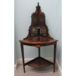 An Edwardian string and marquetry rosewood corner display stand with three graduated, quadrant