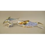 Two Royal Crown Derby china paperweights, viz. a dolphin  3"h; and a 2003 oceanic whale  2"h
