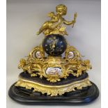 A late 19thC French, elaborately cast gilt metal mantel clock, incorporating blue painted