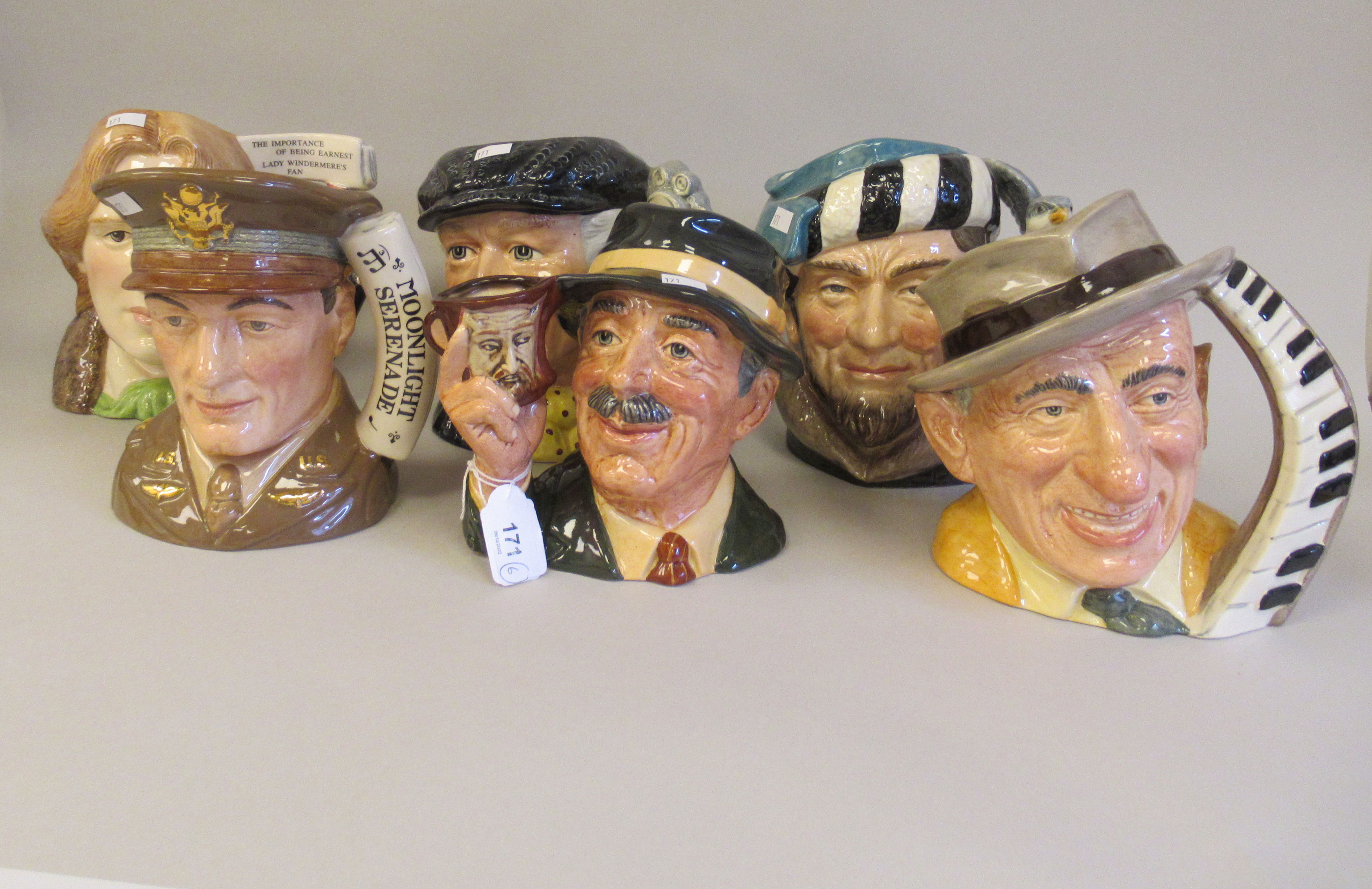 Six Royal Doulton china character jugs: to include 'The Collector' modelled by Stanley James Taylor