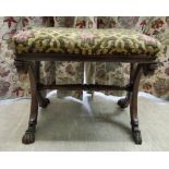 A Regency rosewood framed stool, the later embroidered floral tapestry patterned, cushioned seat,