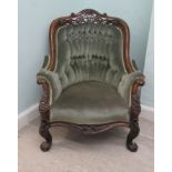 A late Victorian walut showwood framed salon chair with a fret carved, arched crest, over enclosed