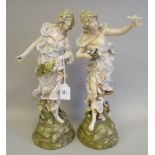 A pair of Turn Wien Austrian Art Nouveau porcelain figures, maidens with flowers and doves, each