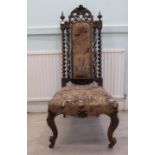 An early/mid 19thC rosewood framed salon chair, the high back with barleytwist flank pillars, floral