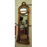 A modern mirror, set in an ornate gilded composition frame  56" x 17"