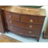 An early 19thC mahogany bow front dressing chest with two short/two long drawers, raised on