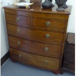 A mid Victorian mahogany bowfront dressing chest with two short/three long drawers, raised on bun