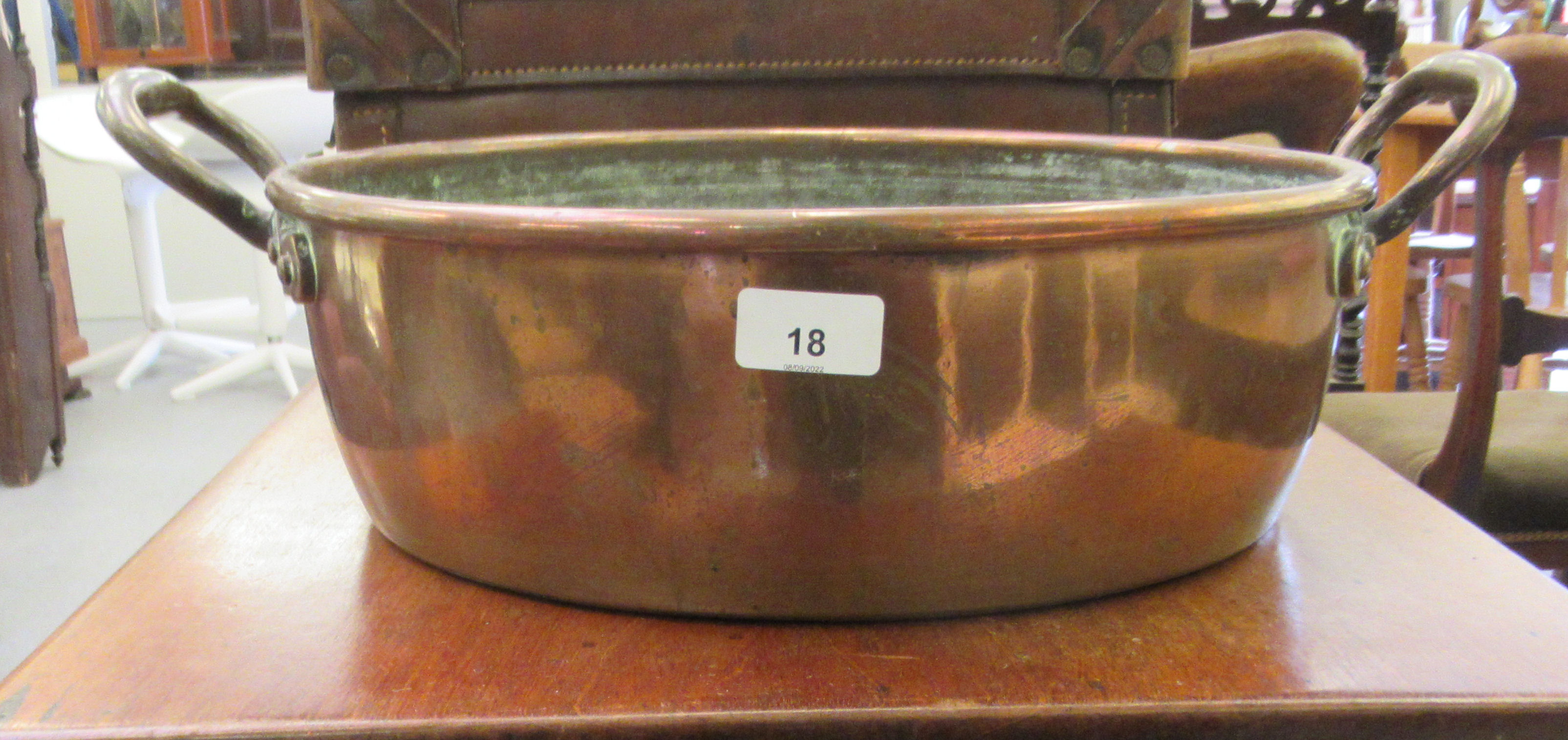 A late Victorian copper and brass preserve pan with opposing handles  14"dia