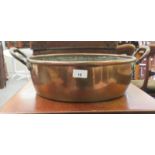 A late Victorian copper and brass preserve pan with opposing handles  14"dia