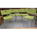 A set of five modern grey painted, tubular metal framed stacking chairs with moulded apple green