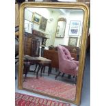 A late Victorian overmantel mirror, in a gilt frame with bead ornament  32" x 40"