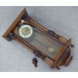 An early 20thC Hamberg American walnut cased regulator with carved ornament; the gong strike