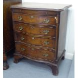 A mid 20thC mahogany and walnut serpentine front dressing chest with a brushing slide and four