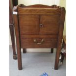 A George III mahogany night commode with two doors and a drawer, raised on square, chamfered legs